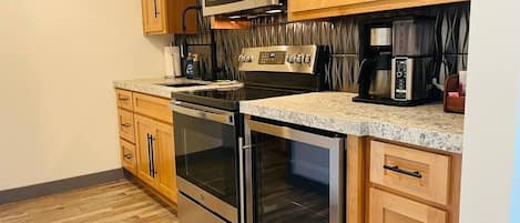 Coffee/tea maker, fridge, microwave, oven