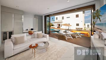 Signature Villa, Hot Tub, Ocean View | Living room | 55-inch Smart TV with cable channels, TV, fireplace