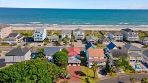 A coastal residential area with houses and a beach in the background. - Pet-Friendly, Steps to the Beach Seahorse Ranch #1 (North Myrtle Beach)