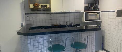 Fridge, microwave, stovetop, coffee/tea maker