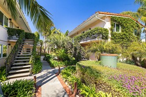 Stunning garden surroundings complement the building's elegant architecture.