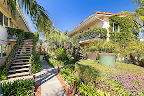 Stroll through the beautifully maintained garden, surrounded by lush greenery and vibrant flowers.