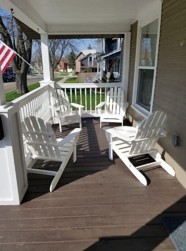 Relax on the covered porch with comfortable Adirondack chairs.