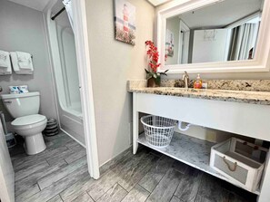Bathtub, hair dryer, towels, soap