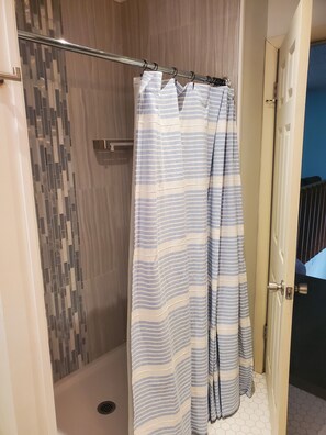 Shower, towels, soap, toilet paper
