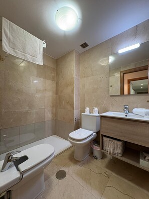 Bathtub, hair dryer, towels