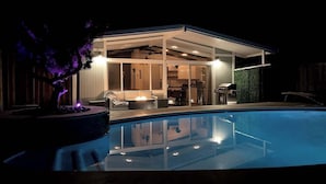 A modern house with a glass-enclosed patio, a pool, and a barbecue area. - Redwood Oasis - Private Heated Pool by State Park! (Felton)