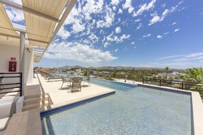 Outdoor pool, open 9:00 AM to 10:00 PM, pool umbrellas, pool loungers