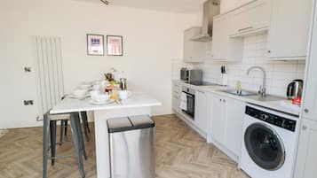 Fridge, dishwasher, electric kettle, cookware/dishes/utensils