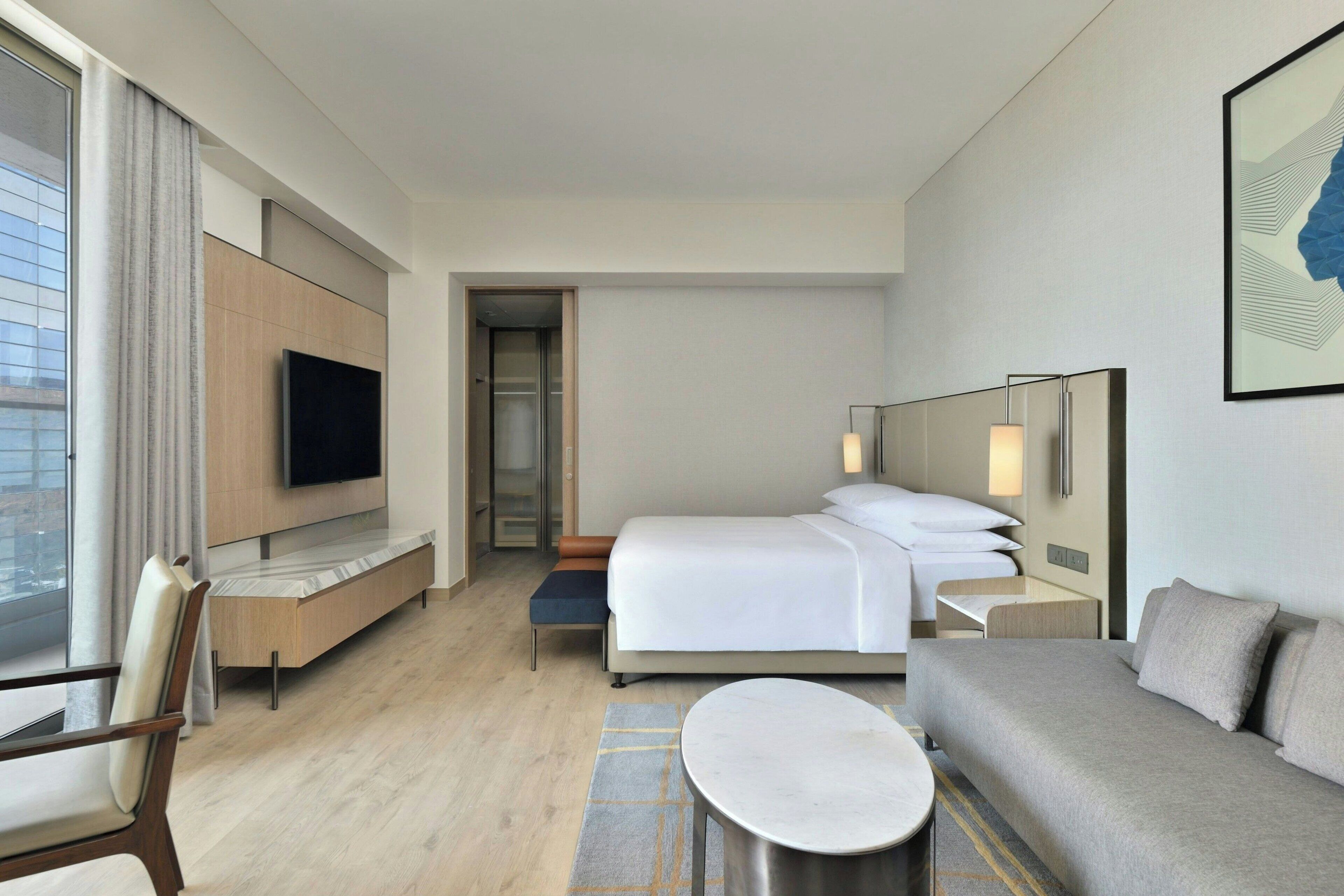 Studio Suite, Balcony, City View | Living area | 56-inch LCD TV with cable channels, TV