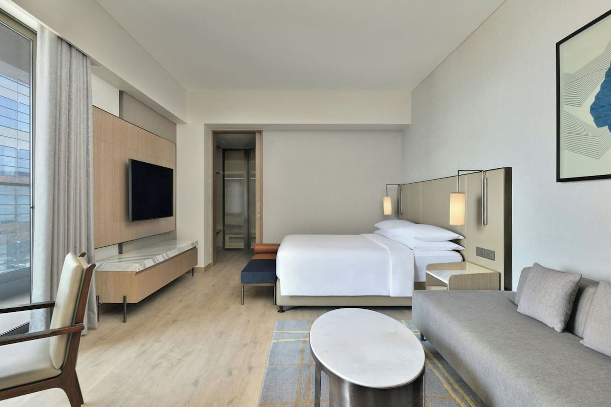 Studio Suite, Balcony, City View | Living area | 56-inch LCD TV with cable channels, TV