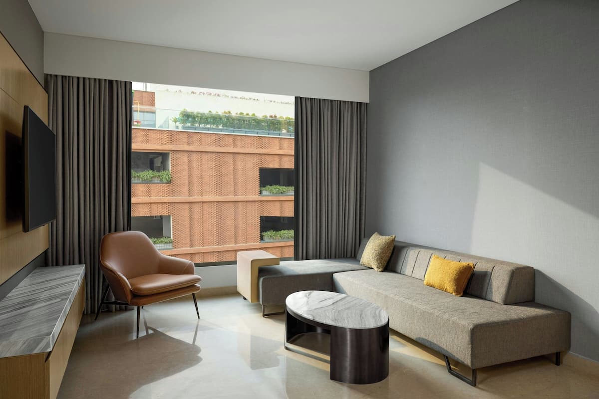 Superior Room, 1 King Bed, Courtyard View | Living room | 56-inch LCD TV with cable channels, TV