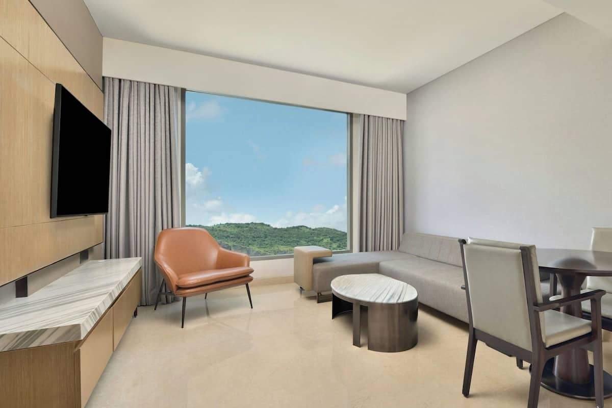 Studio, 1 King Bed, Courtyard View | Living room | 56-inch LCD TV with cable channels, TV