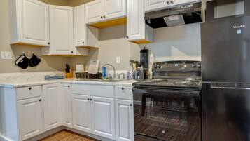 Fridge, microwave, stovetop, coffee/tea maker