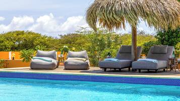 Outdoor pool, pool umbrellas, sun loungers