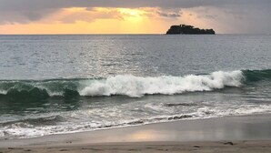 A beach with waves and a distant island. - Oceanview Condo With Pool Near Playa Prieta 2BR - Vida de la Paz 4 (Tempate)