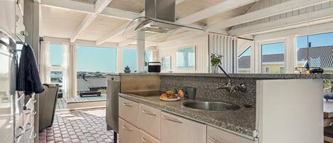 Fridge, stovetop, dishwasher, coffee/tea maker