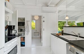 Fridge, stovetop, dishwasher, coffee/tea maker