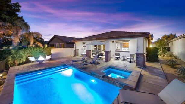 A residential backyard with a swimming pool, lounge chairs, and a patio area. - Luxe Villa On Golf Course 🏌️~ Private Pool/Spa 🏊 ~EV Charger ~ Tennis (Indio)