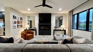 70-inch Smart TV with digital channels, fireplace, streaming services