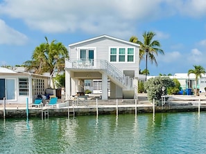 A waterfront house with a balcony, a dock, and a pool area. - Endless Water Views - Venture Out 526 (Cudjoe Key)