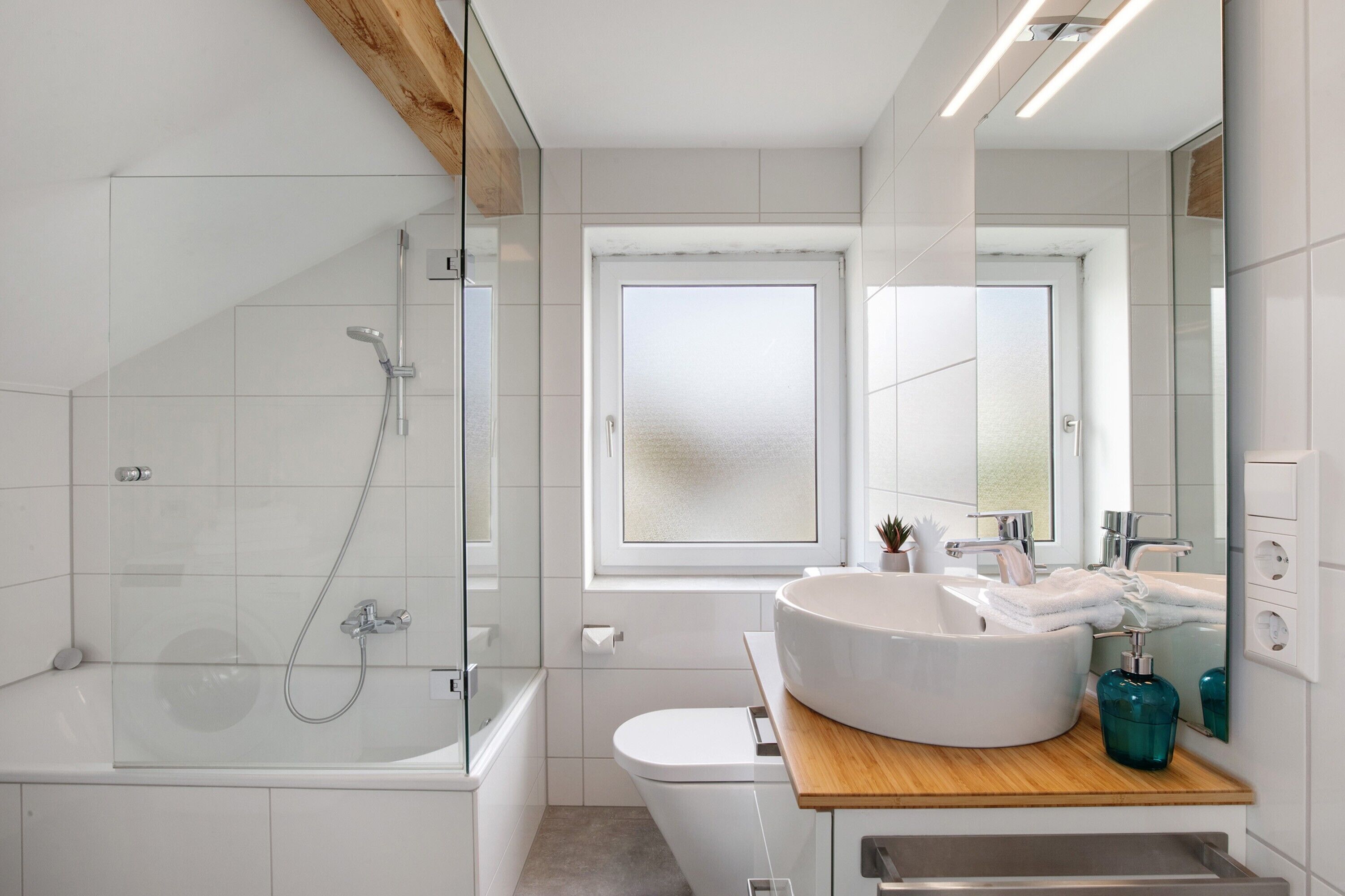 Bathtub, hair dryer, towels