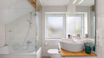 Bathtub, hair dryer, towels