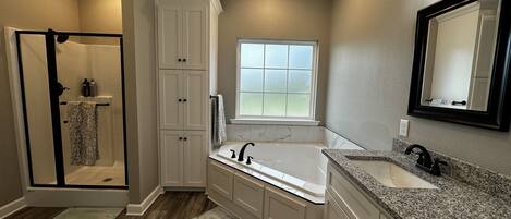 Jetted tub, hair dryer, towels, soap