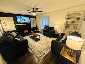 TV, fireplace, books, offices