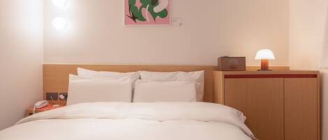 Premium bedding, desk, laptop workspace, free WiFi