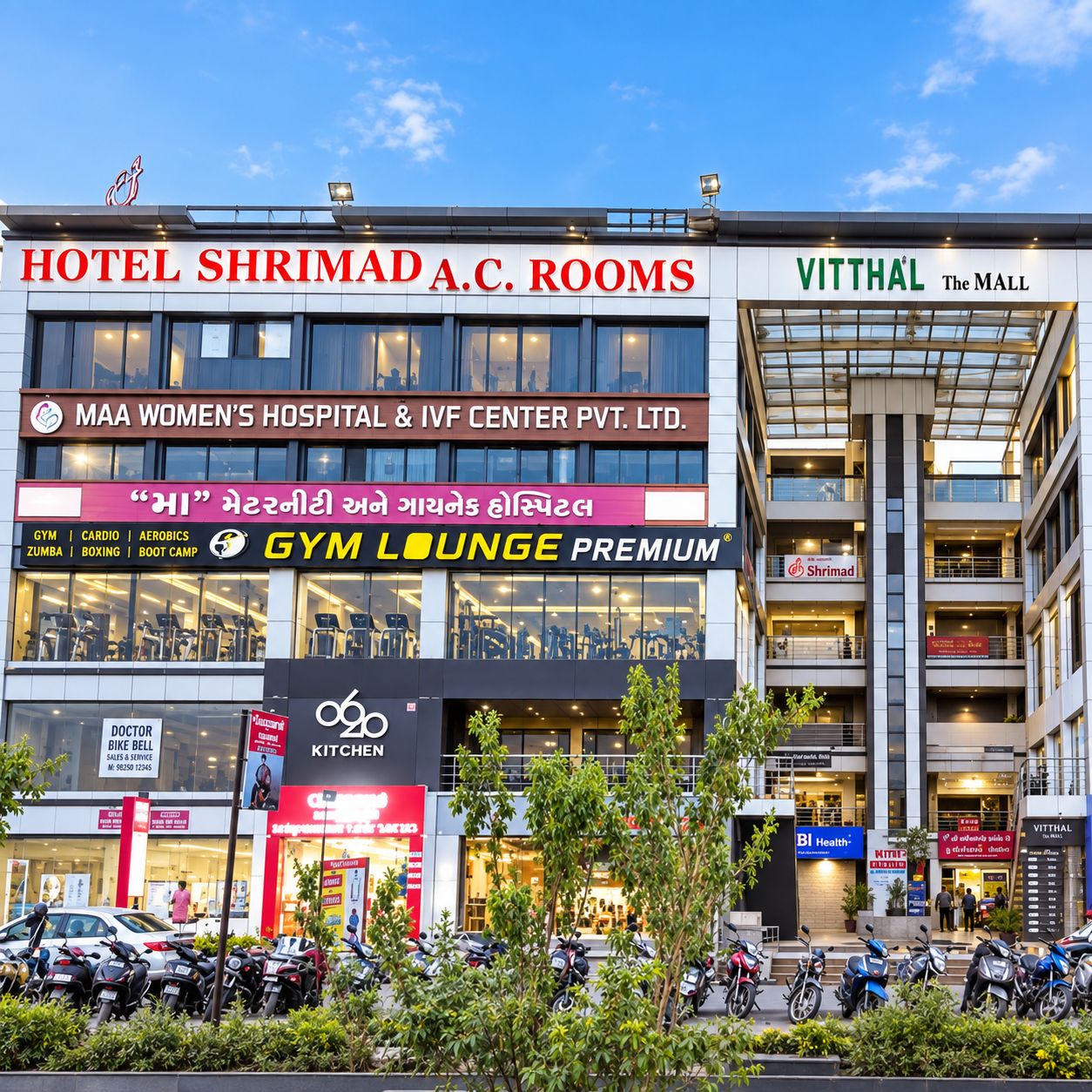 A multi-story building with various commercial establishments including a hotel, a gym, and a health center.