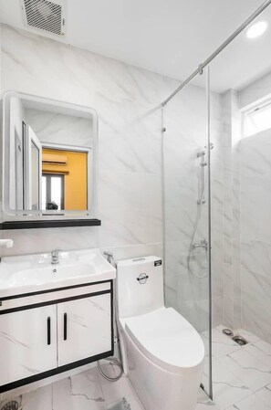 Shower, hair dryer, towels, soap