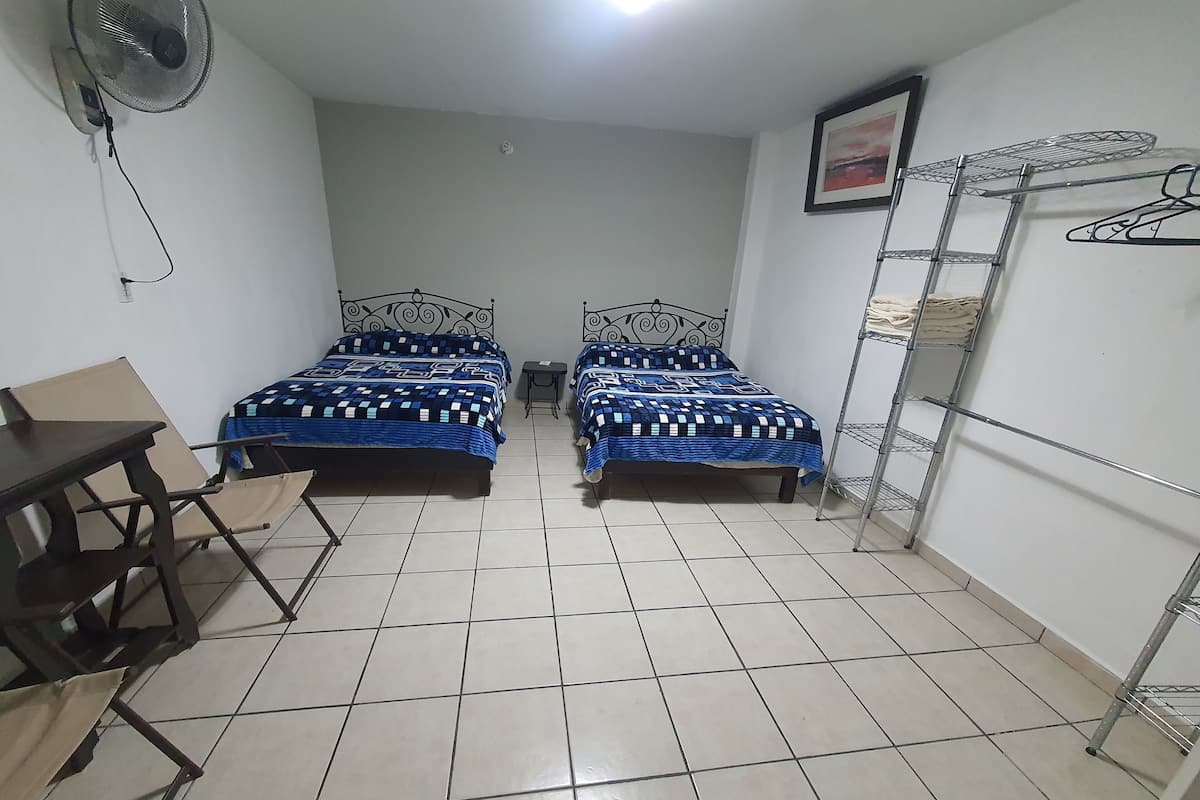 Basic Room, 2 Queen Beds | 1 bedroom, WiFi (free), bed sheets