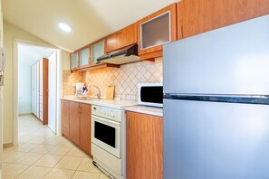 Fridge, oven, stovetop, cookware/dishes/utensils - Apartment "Soffitta Bampina" close to the Beach with Balcony (????ss???)