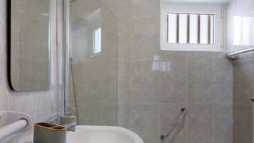 Bathtub, hair dryer, towels