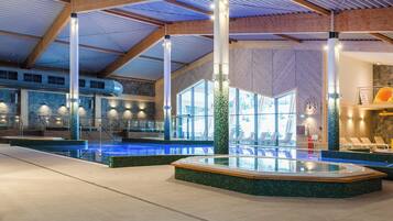 Indoor pool, open 8:00 AM to 10:00 PM, pool loungers, lifeguards on site