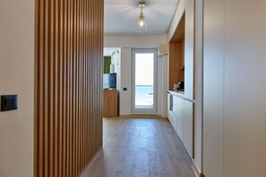 Deluxe Studio | Living area | Flat-screen TV