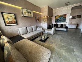 Honeymoon Apartment | Living area | Flat-screen TV