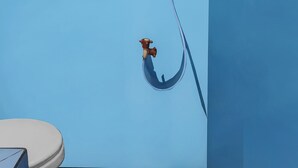 A bathroom with a blue wall, a white toilet, and a shower with a hose. - OYO Homes 91151 Desa Wisata Kreatif Perdamaian Srumbung Gunung (Bawen)