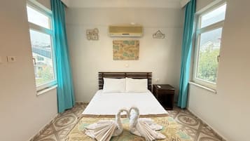 Economy Room | 1 bedroom, desk, blackout drapes, iron/ironing board