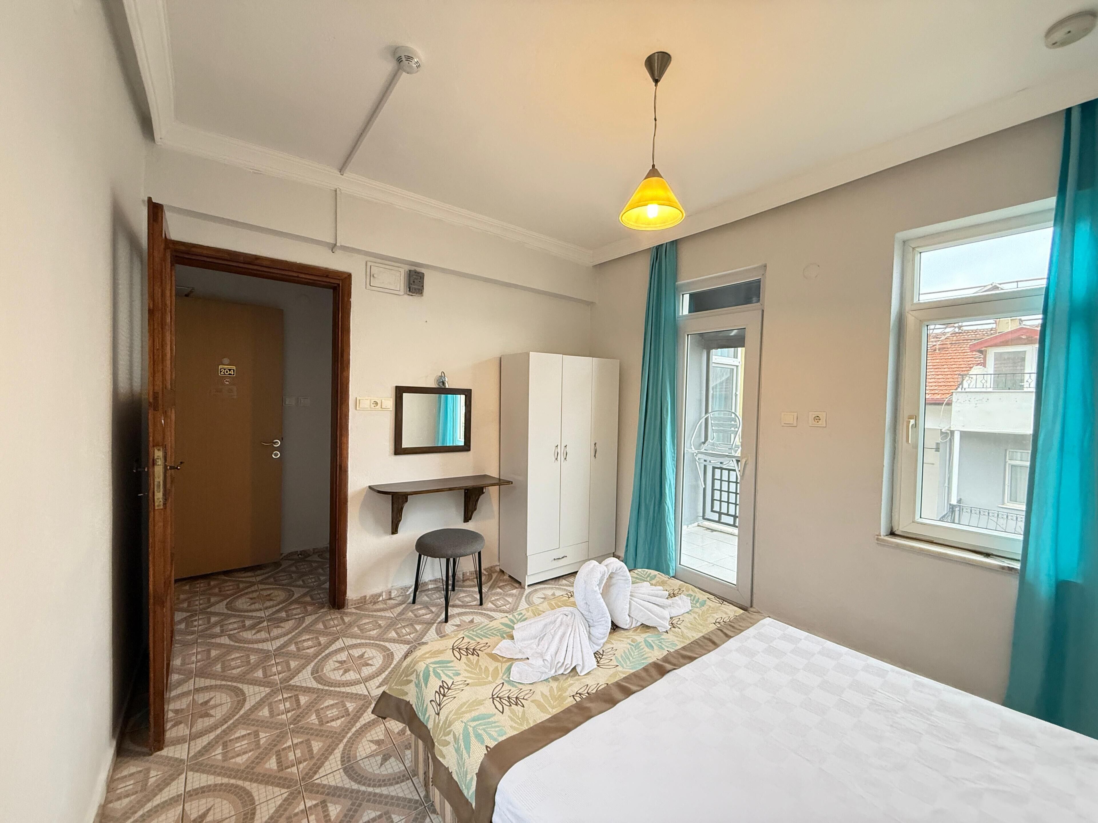 Economy Room | 1 bedroom, desk, blackout curtains, iron/ironing board