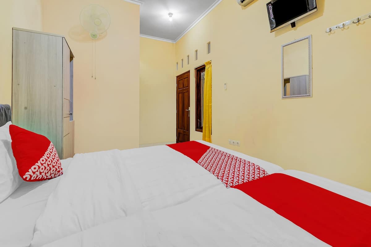 Laptop workspace, bed sheets