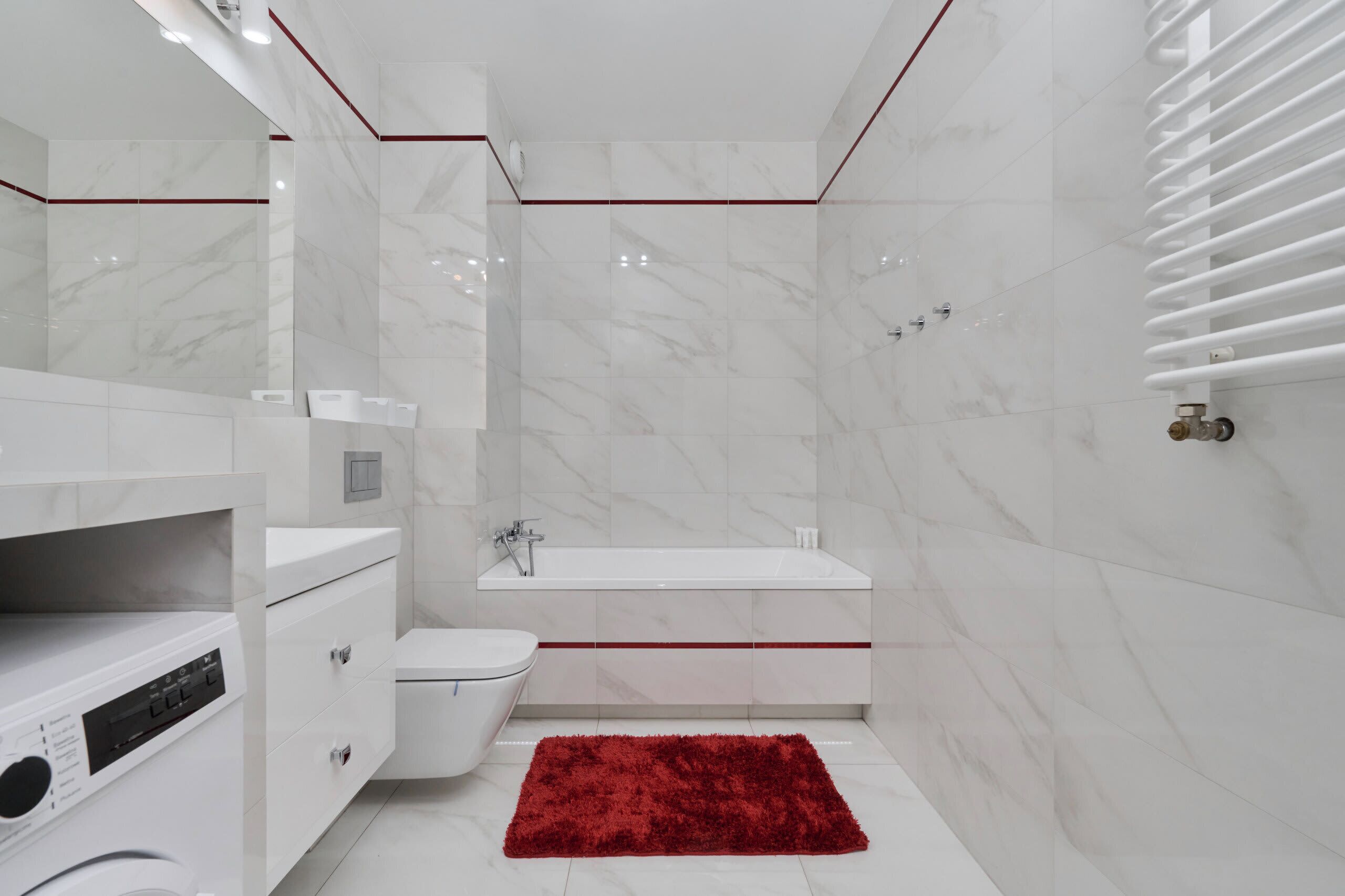Bathtub, hair dryer, towels, shampoo