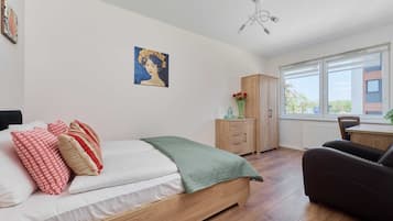 1 bedroom, desk, iron/ironing board, travel crib