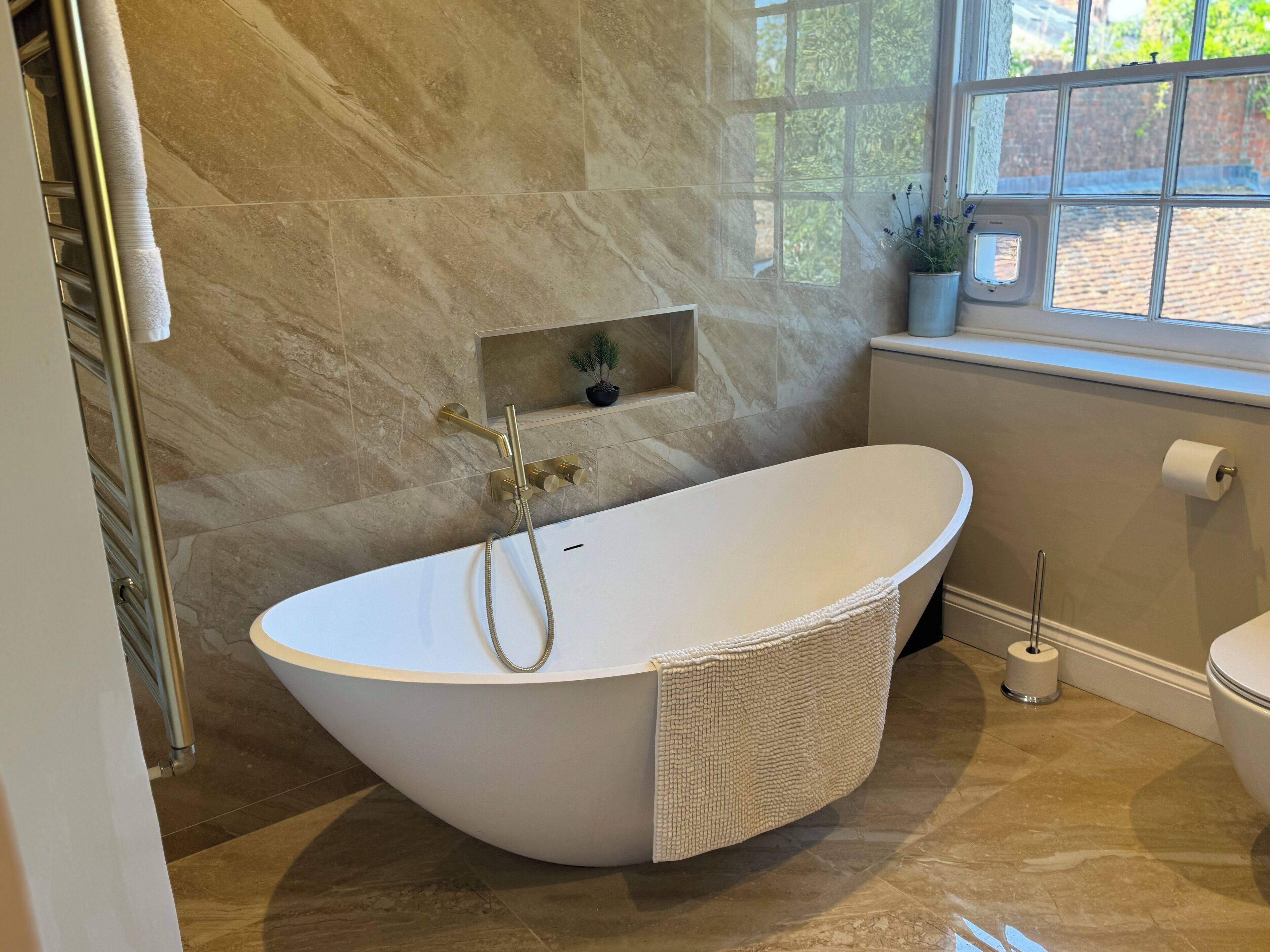 Shower, towels, soap, toilet paper