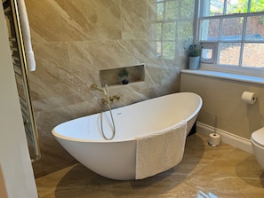 Shower, towels, soap, toilet paper