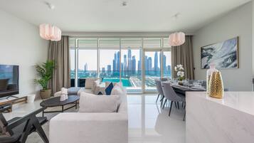 Luxury Apartment, 3 Bedrooms, Non Smoking, Sea View | Living area | 55-inch Smart TV with cable channels, TV, streaming services