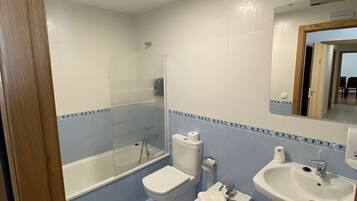 Family Apartment | Bathroom | Hair dryer, towels, toilet paper