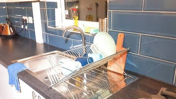 Fridge, microwave, cookware/dishes/utensils