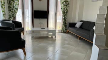 Standard Condo, 2 Bedrooms, Garden View | Living area | 32-inch LCD TV with satellite channels